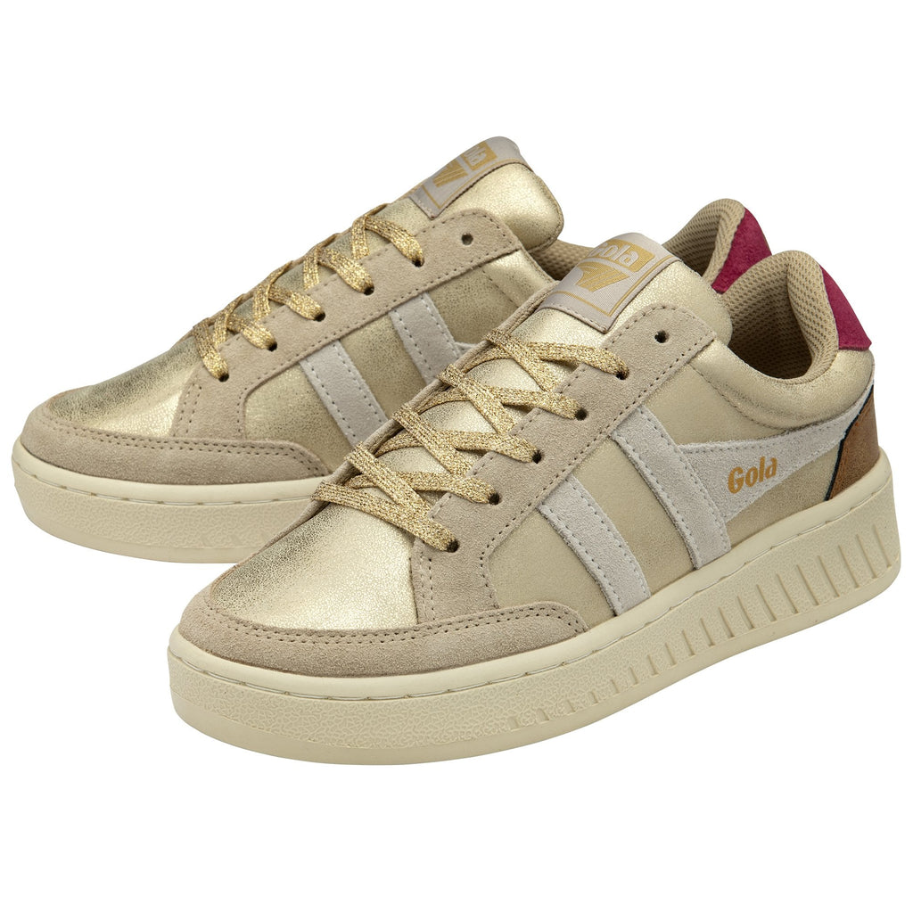 Pair of gold metallic and beige Gola sneakers with red heel details.