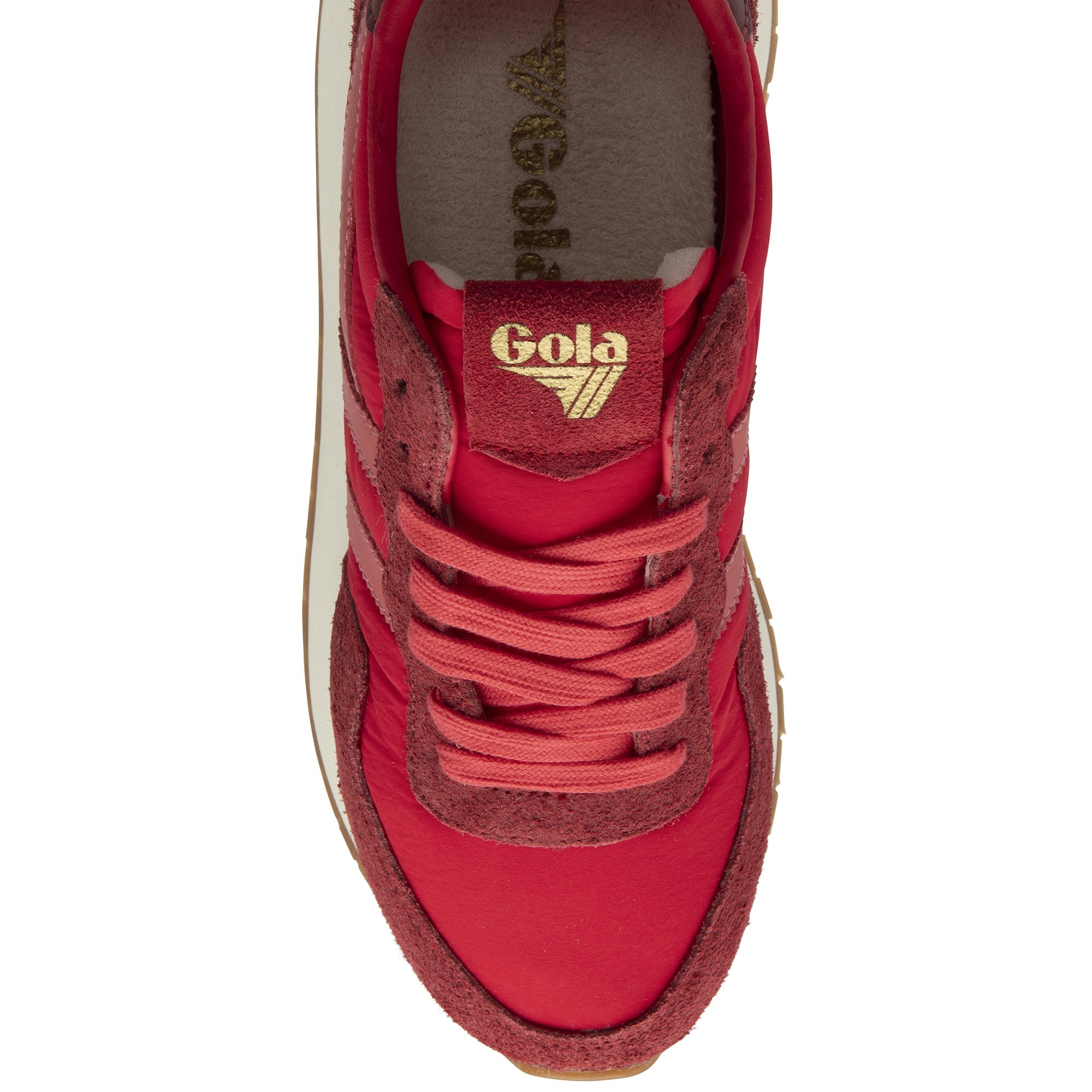Top-down view of a red Gola sneaker, highlighting the gold logo on the tongue and laces.
