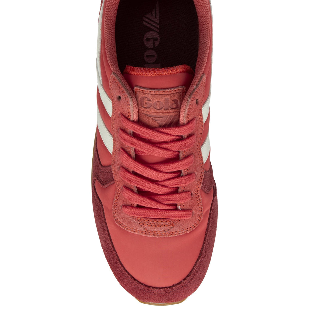 The top view of a red Gola trainer. 