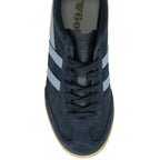 An overhead view of a Gola low-top navy and light blue sneaker with a gum sole.