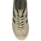 The top-down view of a single Gola Harrier trainer in tan with green stripes.