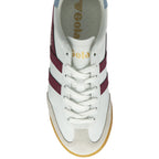 An overhead view of a Gola trainer with white laces, burgundy stripes, and a gum sole.
