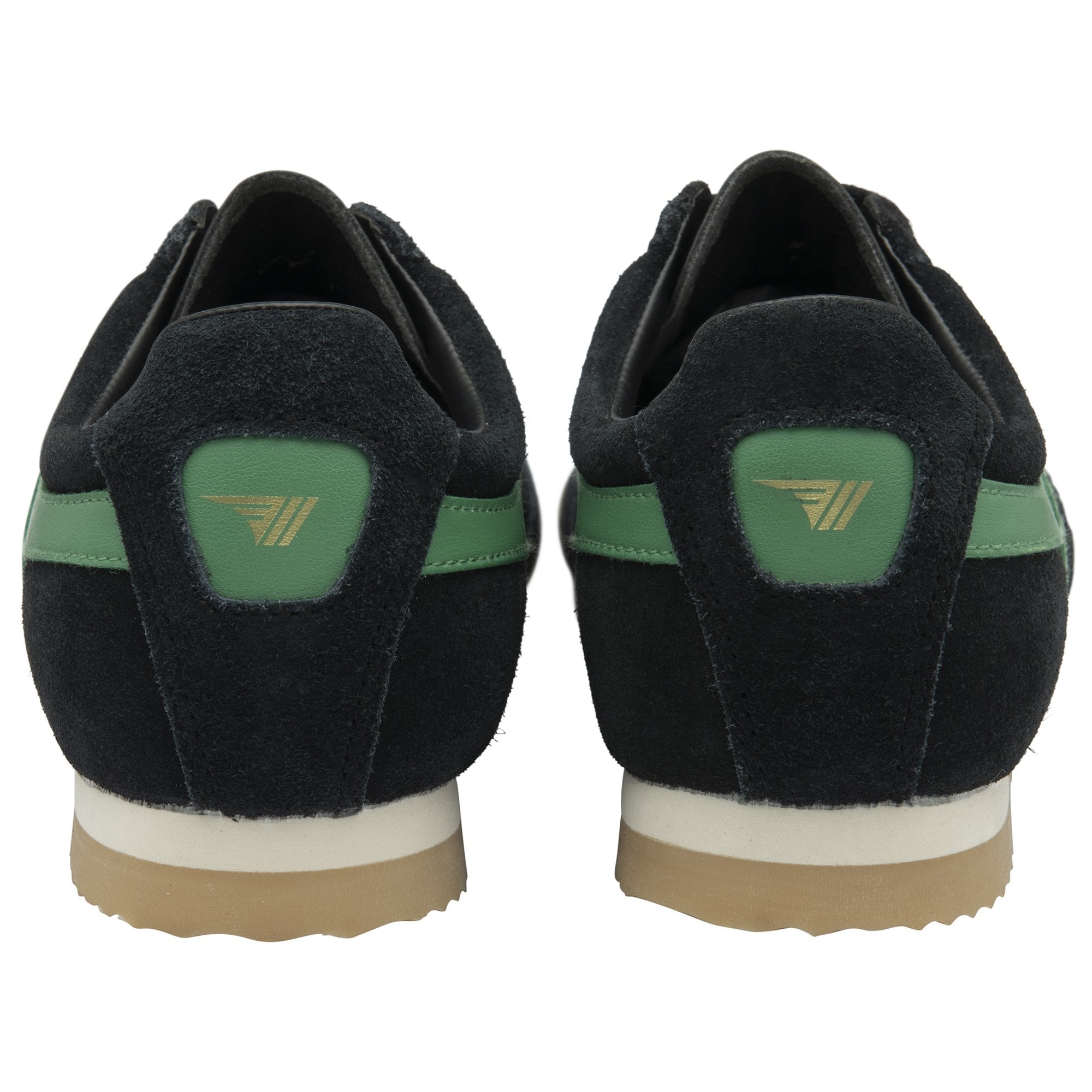 The back view of a pair of black sneakers with green accents and light brown soles.