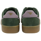 The back of a pair of Gola low-top sneakers, dark green suede with light pink heel tabs.