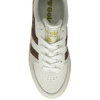 Top-down view of a white Gola sneaker with brown stripes and white laces.