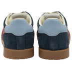 The back view of a pair of navy blue Gola trainers with light blue heel trim.