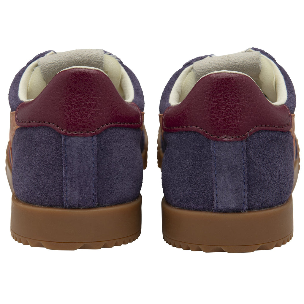The back view of two purple and maroon Gola sneakers with brown soles.