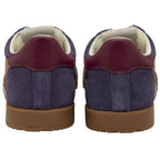 The back view of two purple and maroon Gola sneakers with brown soles.
