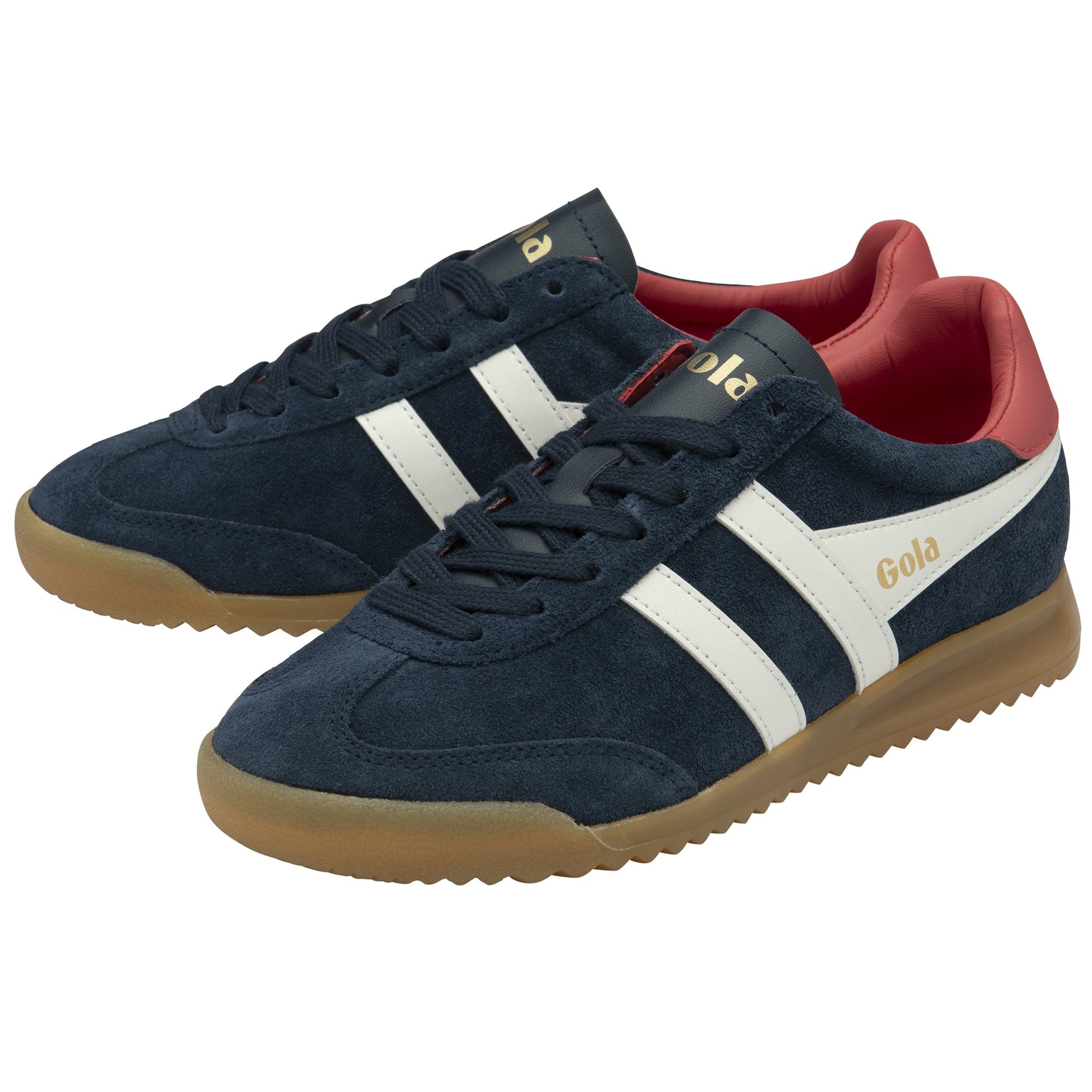A pair of navy blue Gola Harrier trainers with white stripes and red heel tabs.