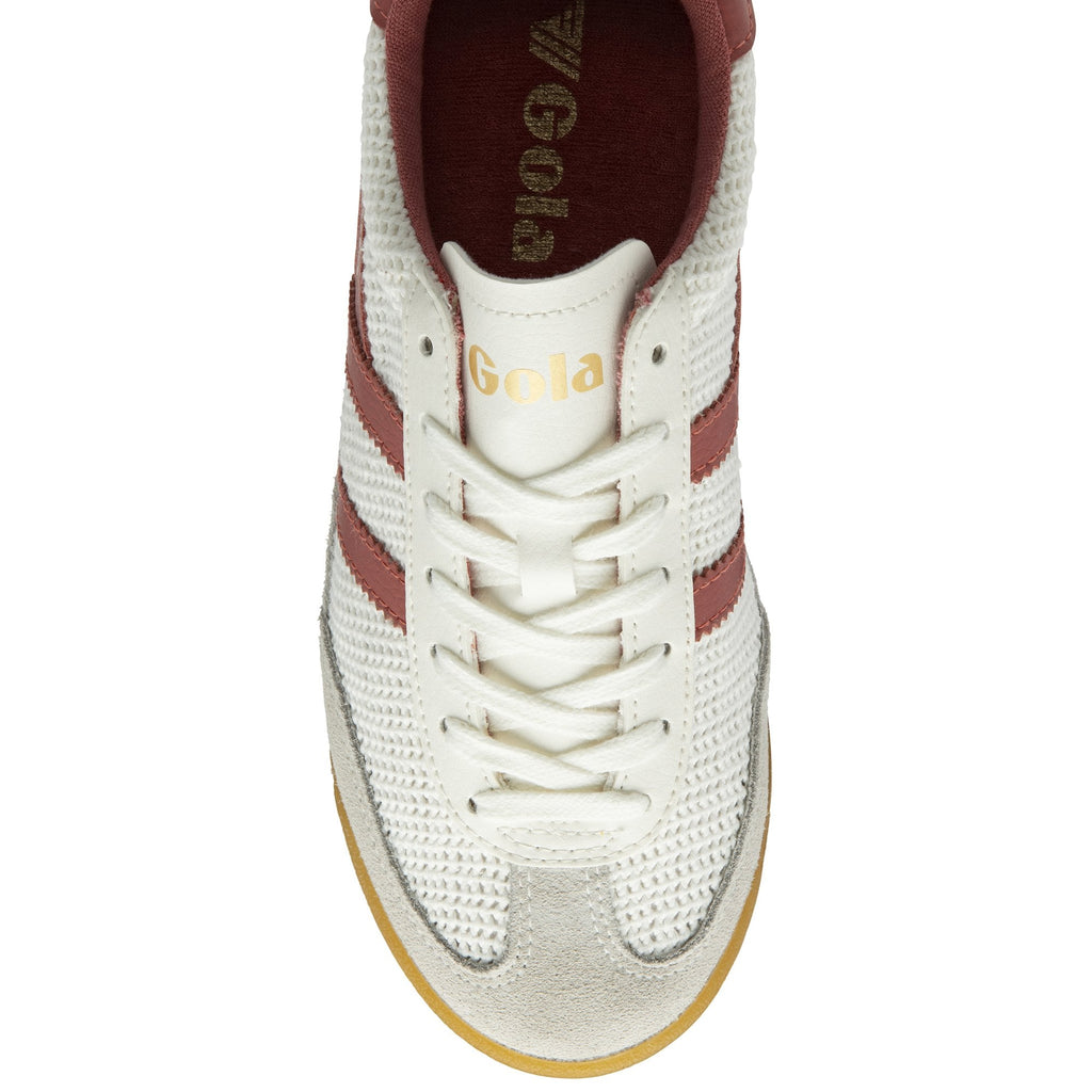 Top down view of a white Gola sneaker with red stripes and white laces.