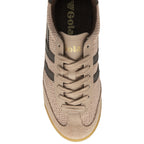 Top-down view of a single Gola men's sneaker in tan with brown stripes and laces.