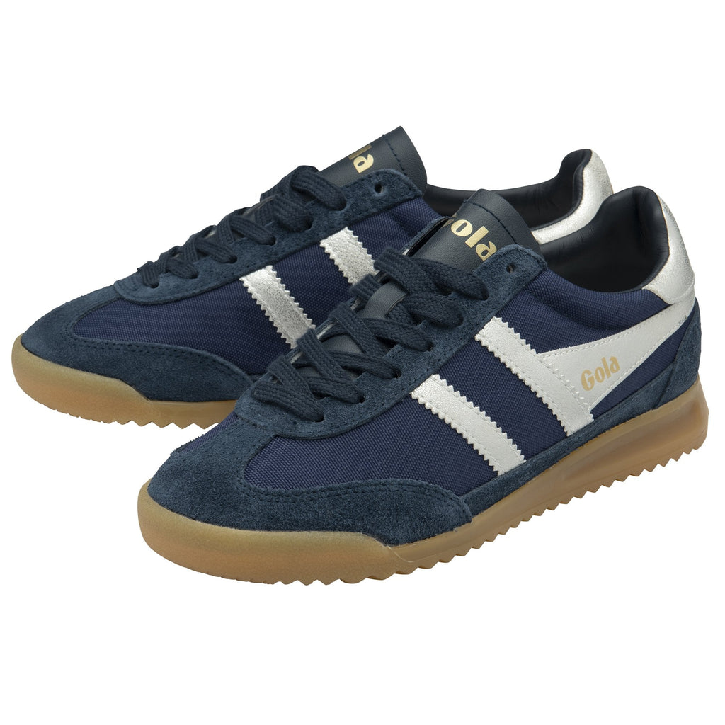 A pair of Gola Harrier trainers in navy with white stripes and gum soles.