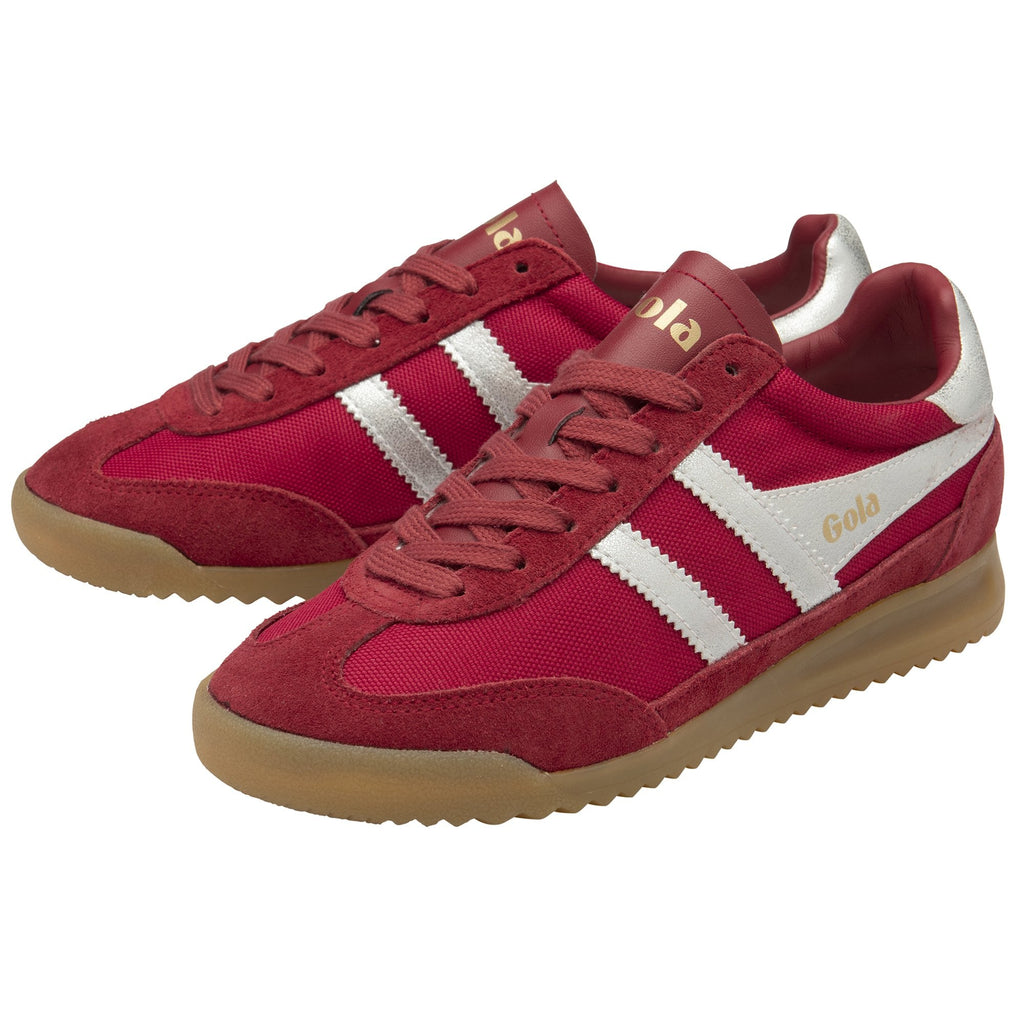 A pair of red and white Gola trainers with tan soles, angled slightly.