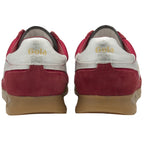 A pair of red and white Gola trainers with tan soles, viewed from the back.