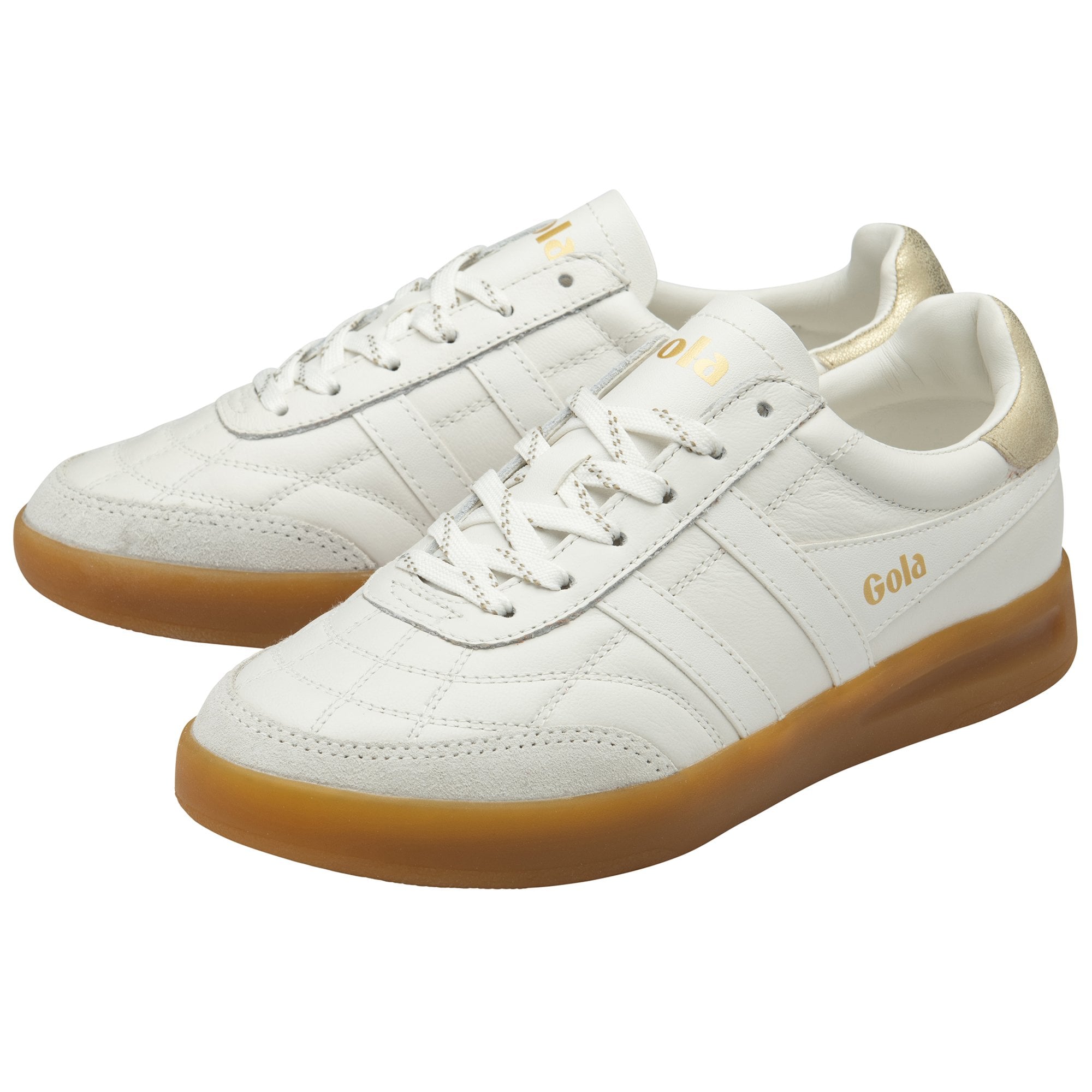 A pair of white and gold Gola sneakers with gum soles, angled toward the right.