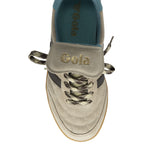 Top-down view of a single beige Gola sneaker with black stripes and patterned laces.