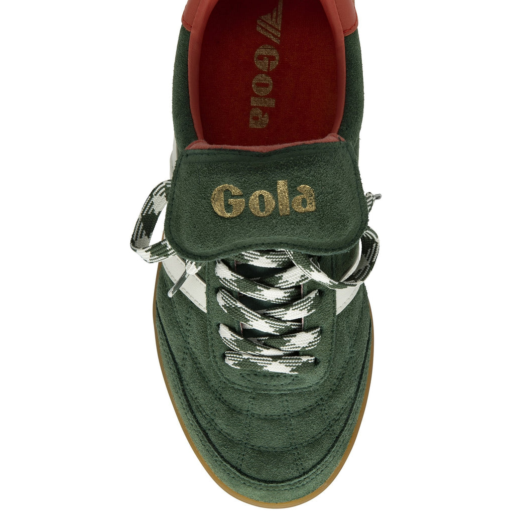 The top-down view of a single dark green suede sneaker with white stripes and patterned laces.