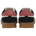 The back view of a pair of black sneakers with red heels and gum soles.