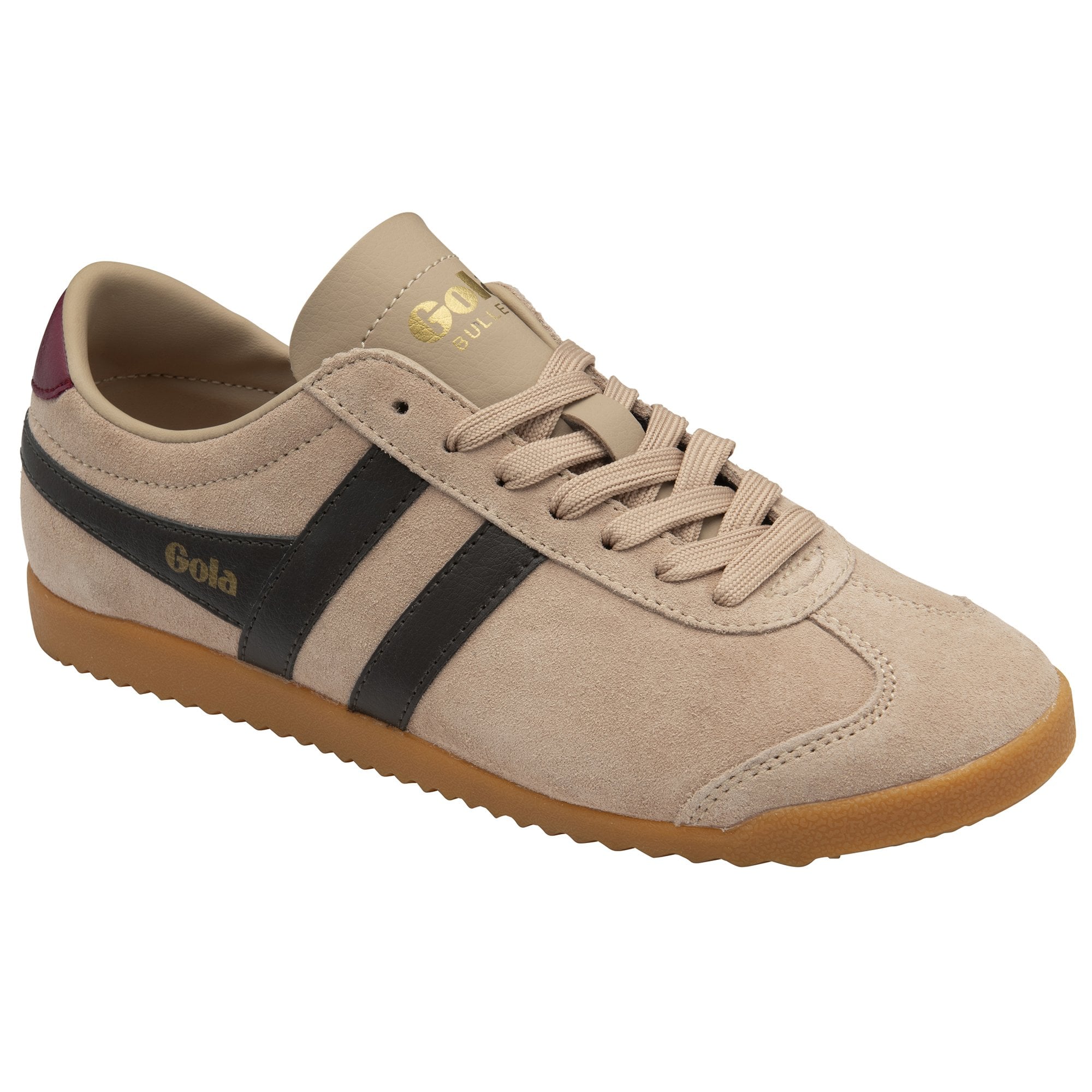 Angled view of a Gola Harrier trainer in tan with black stripes and a maroon heel tab.