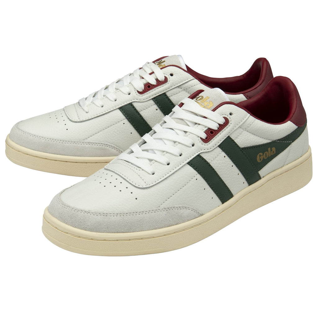 A pair of white Gola sneakers with green stripes and maroon accents.
