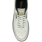 Top view of a white Gola men's sneaker with green sole and white laces.