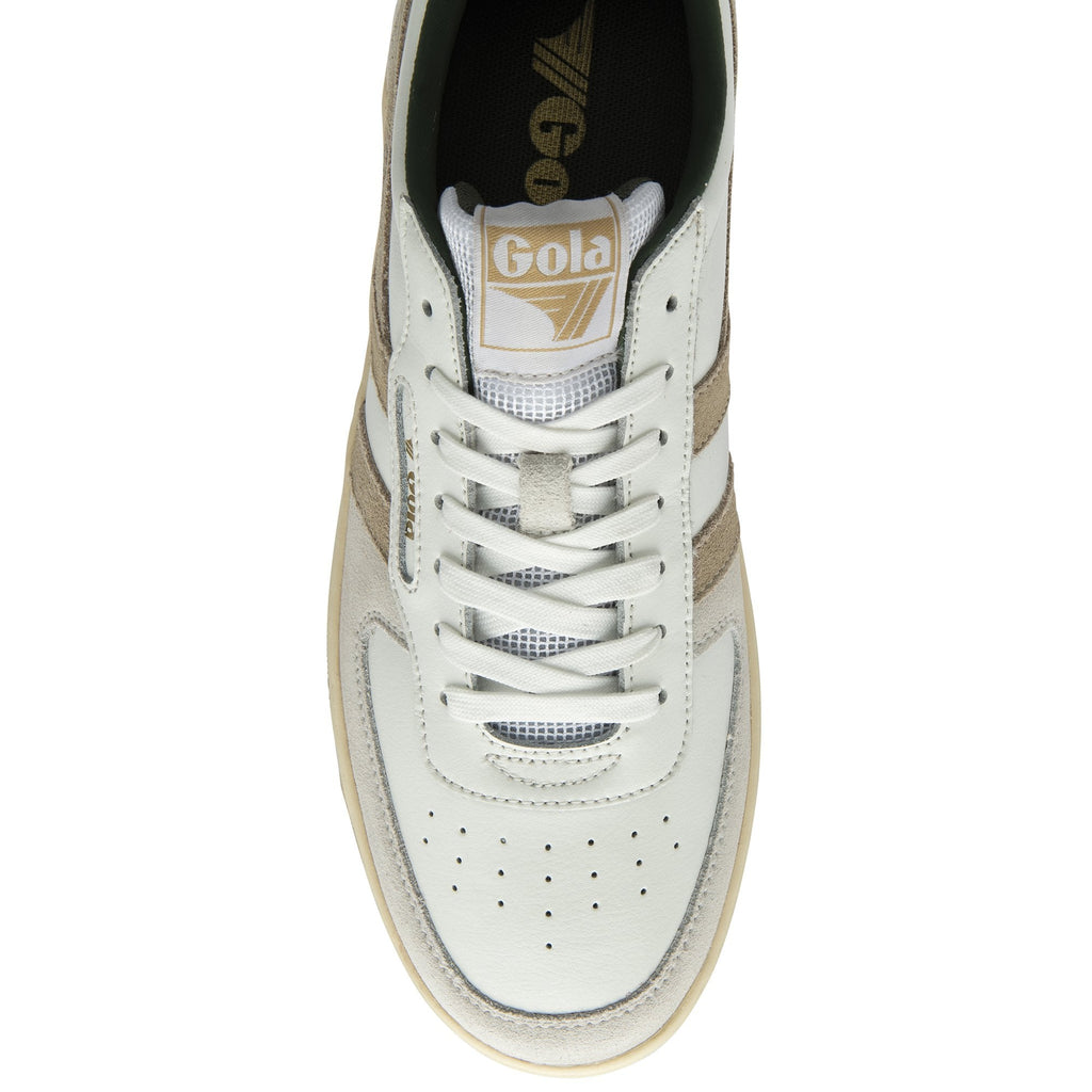 A white sneaker with beige stripes and green lining, viewed from directly above.