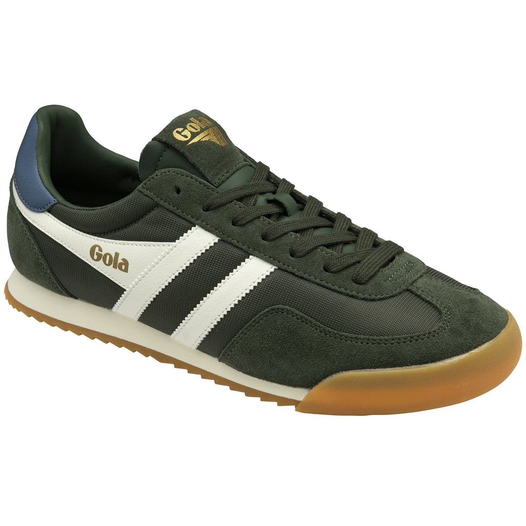 A dark green Gola Harrier trainer with white stripes and a brown sole.
