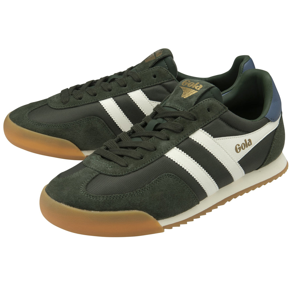 A pair of dark green Gola Harrier trainers with white stripes.