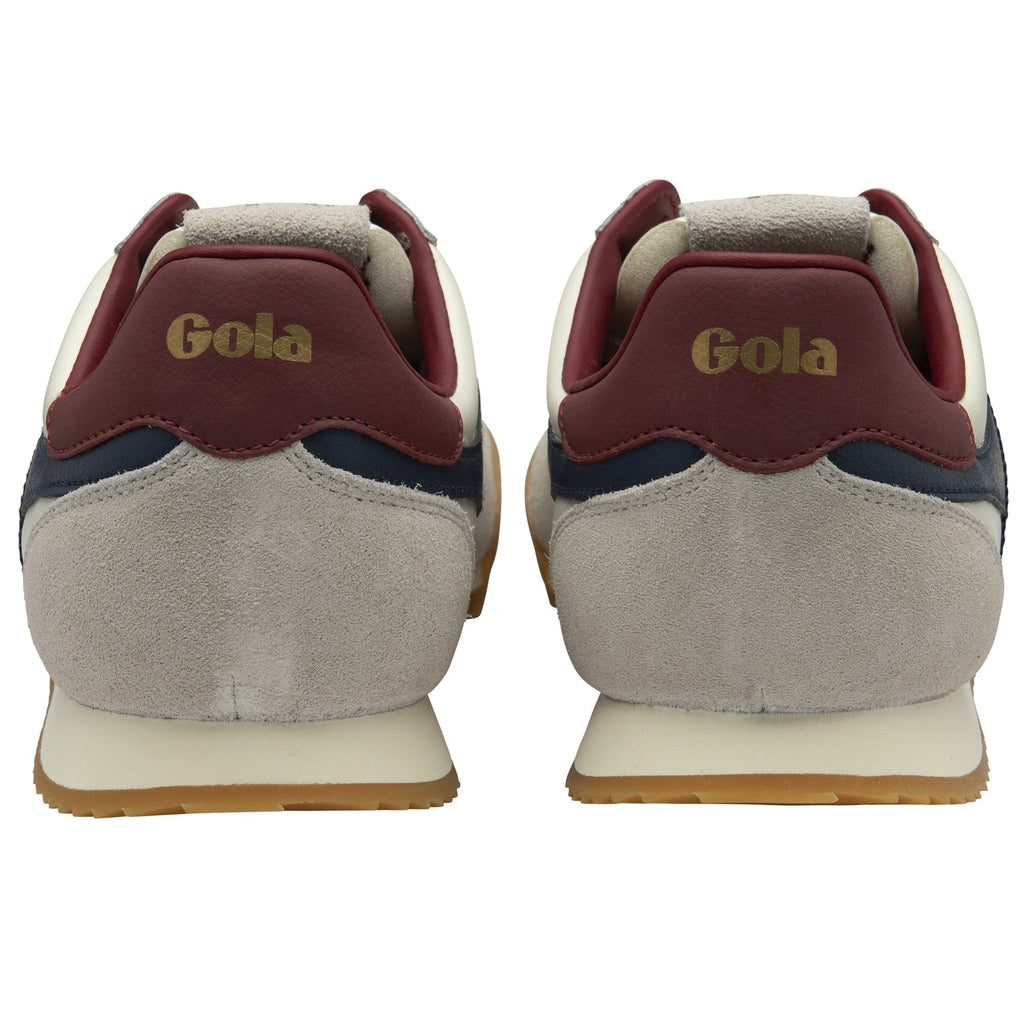 Rear view of a pair of white Gola Harrier Trainers with burgundy heels.