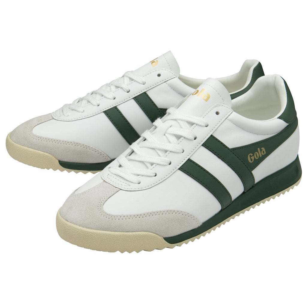 Pair of white Gola sneakers with green stripes and light grey toes.