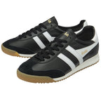 A pair of black Gola men's sneakers with white stripes and gold branding.