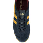 Top-down view of a Gola men's shoe, in dark blue with yellow stripes and a red heel tab.