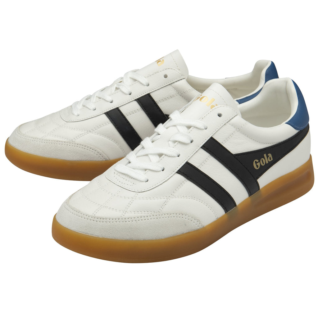 A pair of Gola sneakers in white, black, and blue with gum soles.