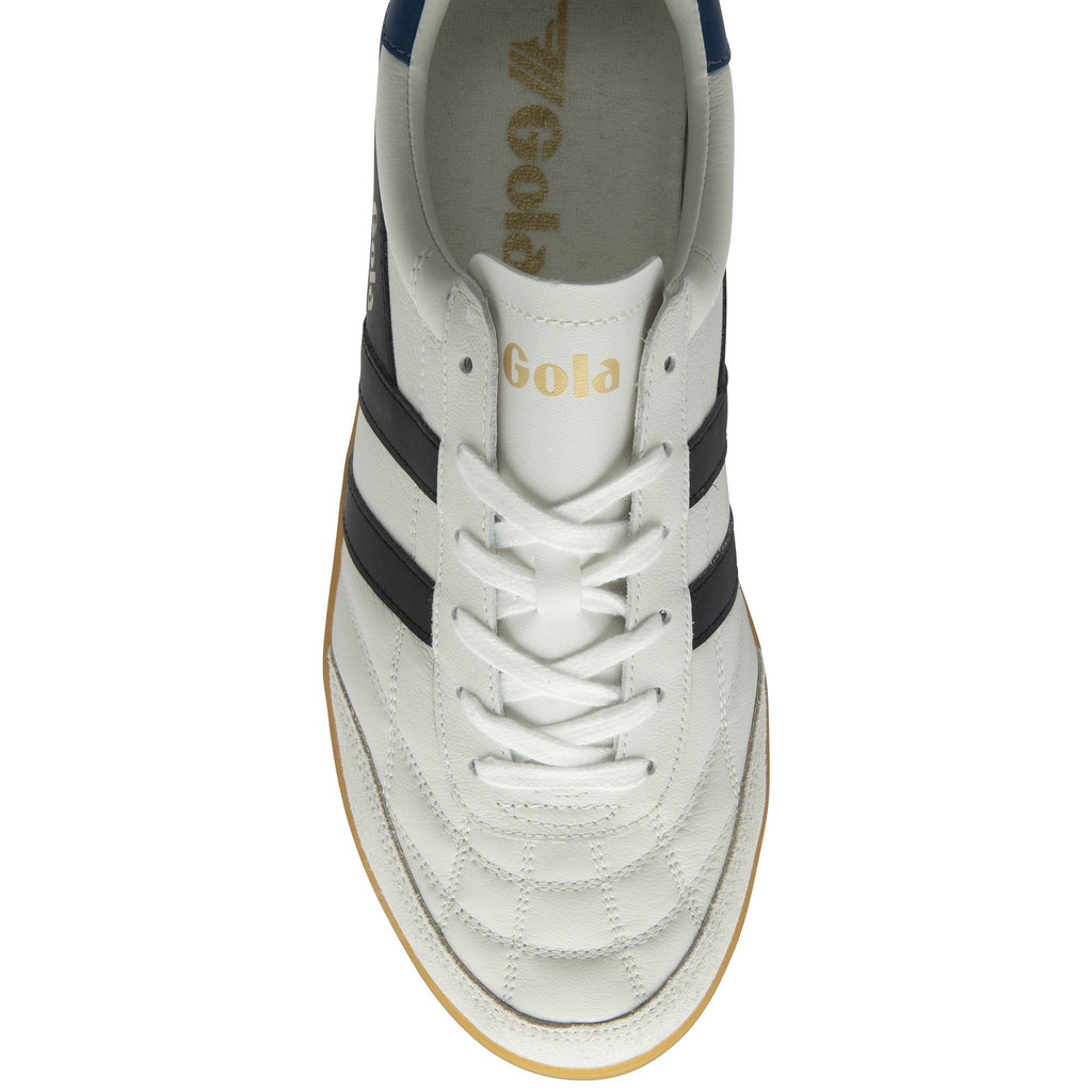 An overhead view of a single white Gola sneaker with black stripes and laces.