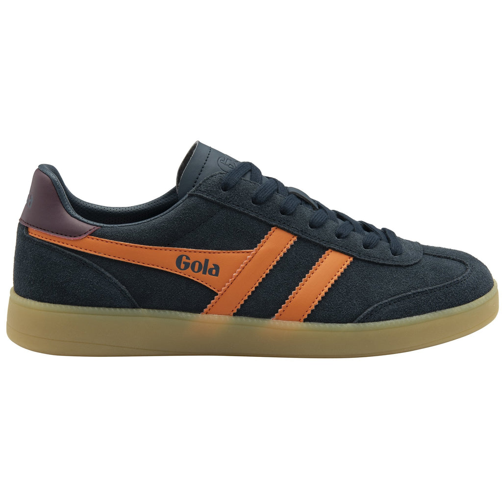 A single Gola trainer, side view, dark blue with orange stripes and brown sole.