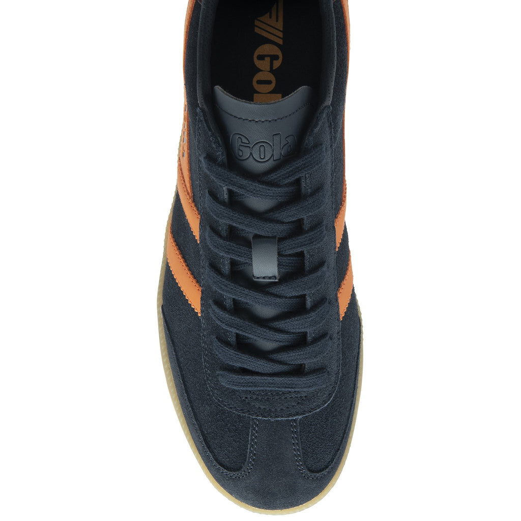 A single Gola trainer, top down view, dark blue with orange stripes.