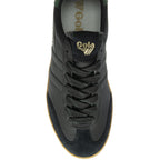 Top-down view of a black Gola trainer with black laces and a gum sole.