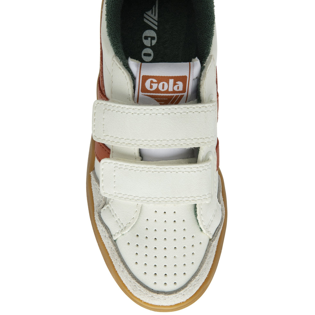 The top-down view of a white Gola sneaker with orange stripes and velcro straps.