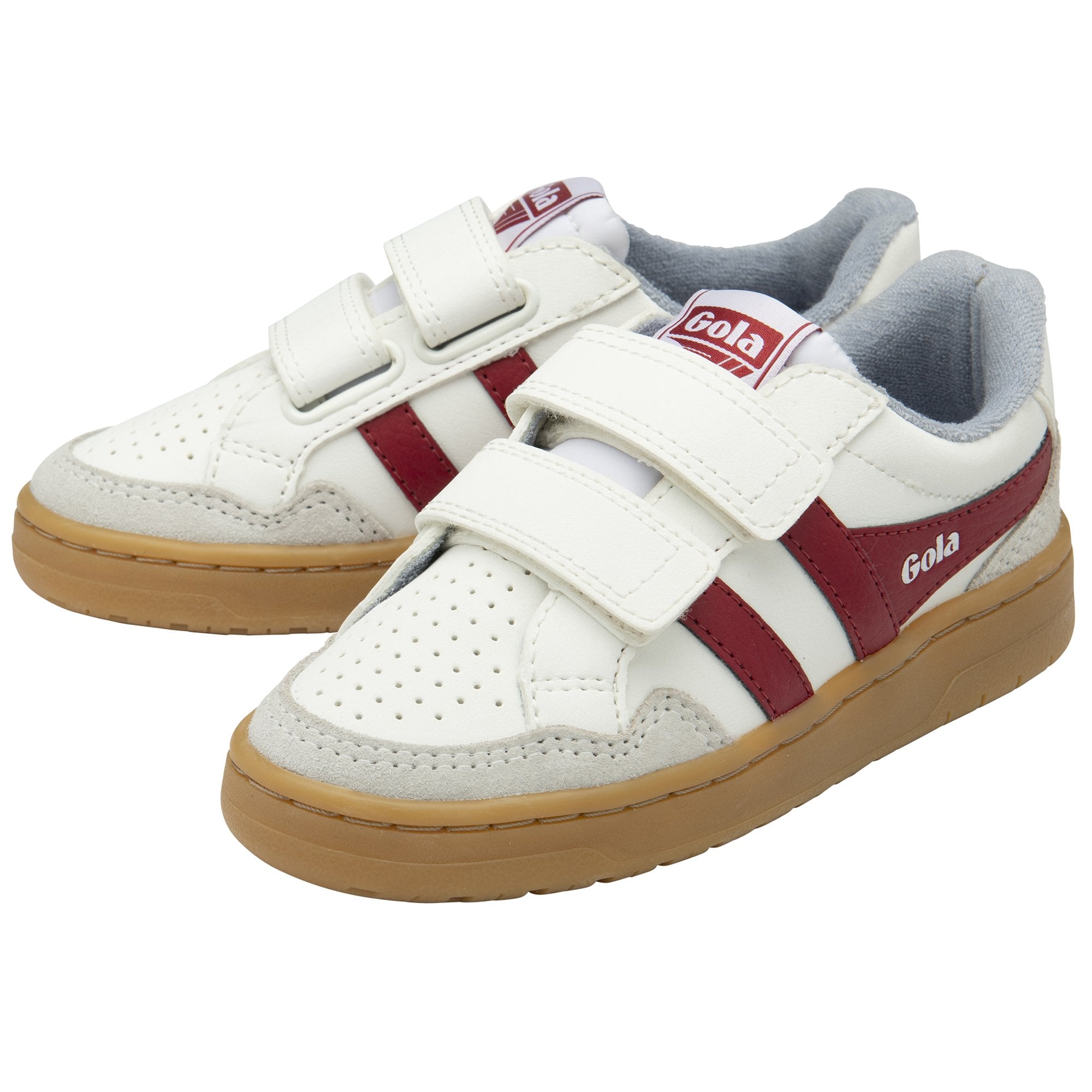 A pair of white sneakers with two red stripes and two velcro straps. The soles are brown.