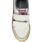 The front of a white sneaker with two red stripes and two velcro straps. The sole is brown.