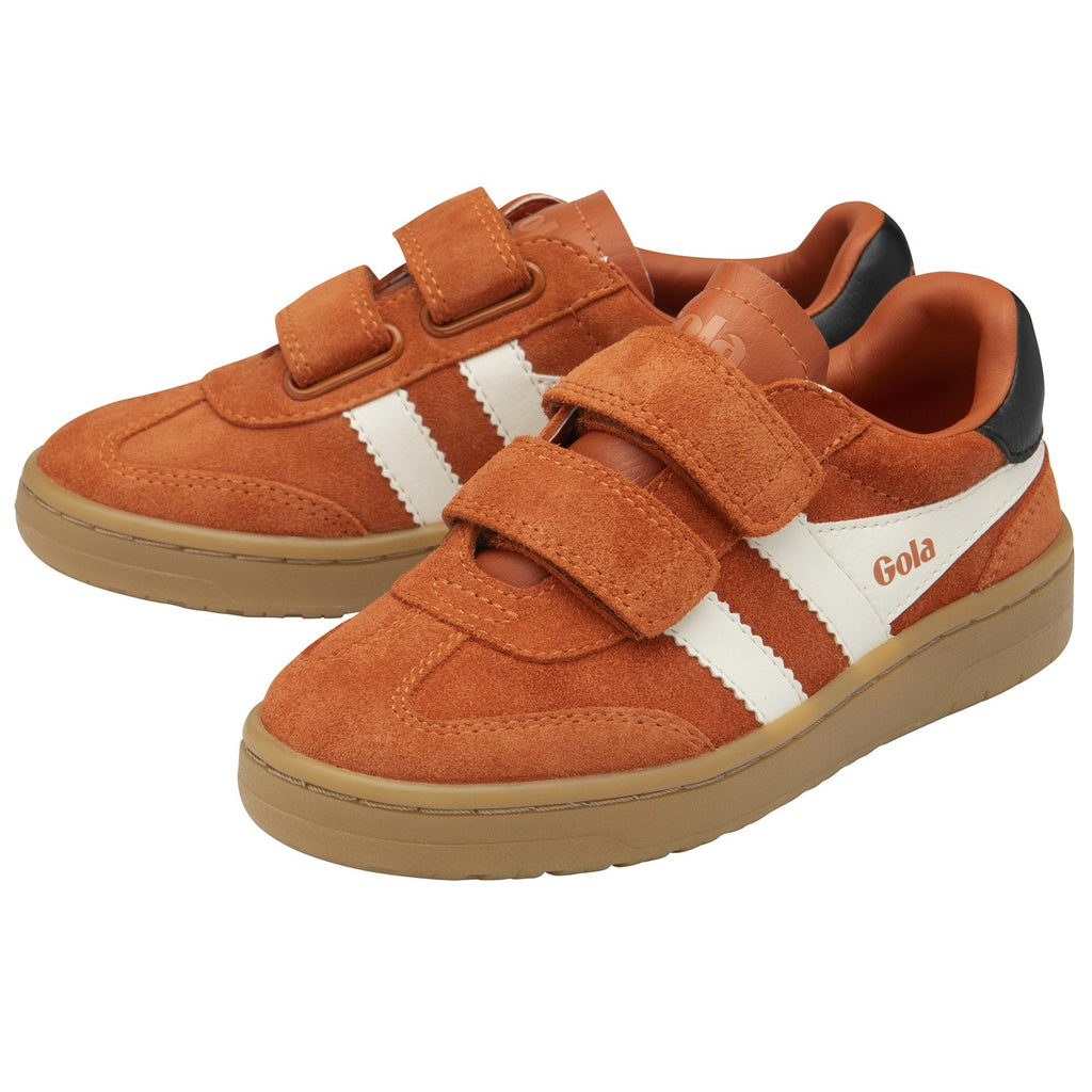Pair of Gola kids' Velcro sneakers in tan with white stripes from an elevated side view.