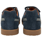 Rear view of two navy blue shoes with brown soles and orange inner lining.