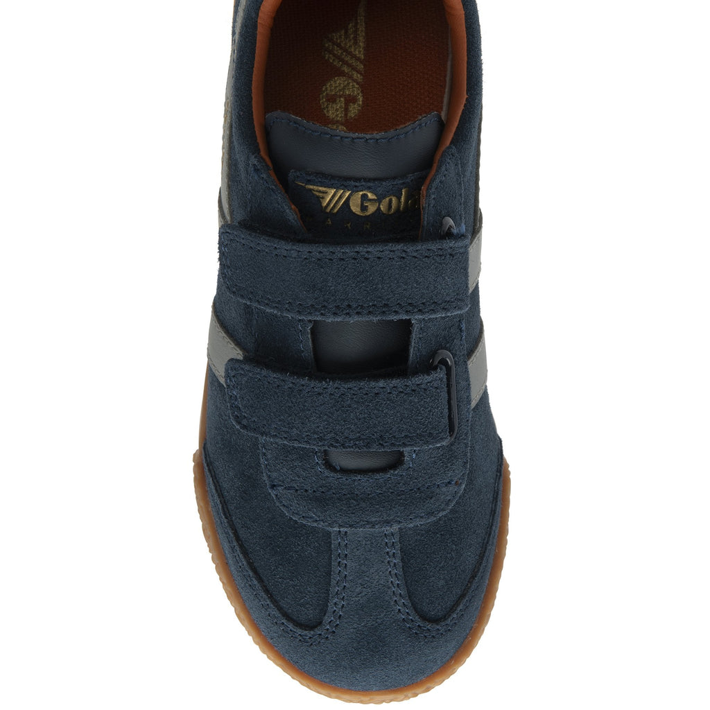 Top-down view of a single navy blue shoe with three velcro straps.