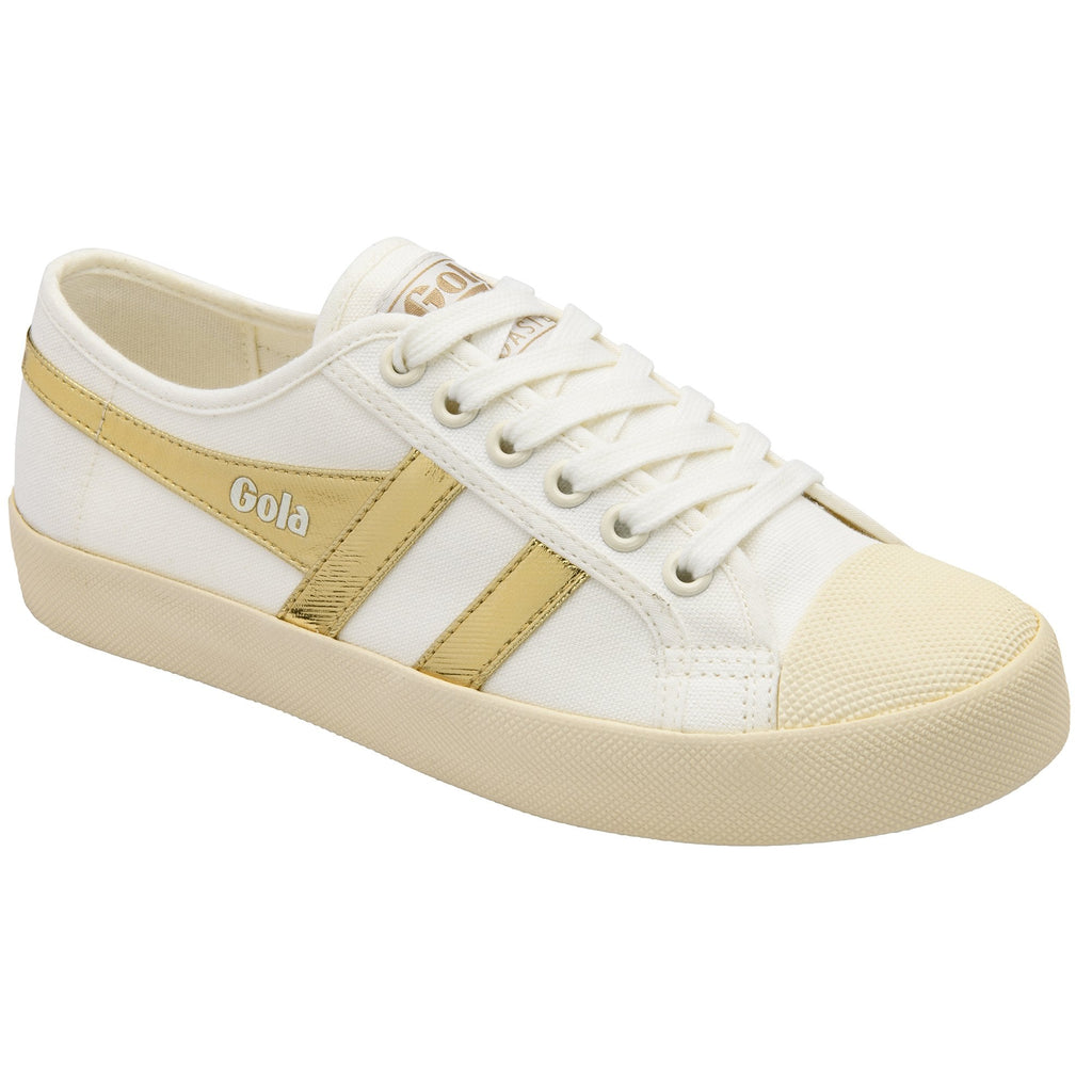 White Gola sneakers with gold stripes and laces.