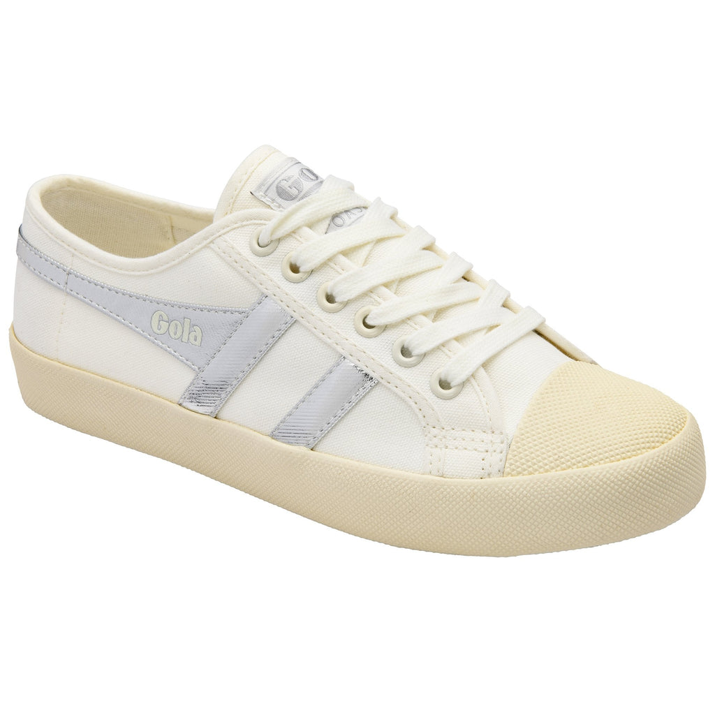 White canvas sneaker with light gray stripes and off-white laces and sole.