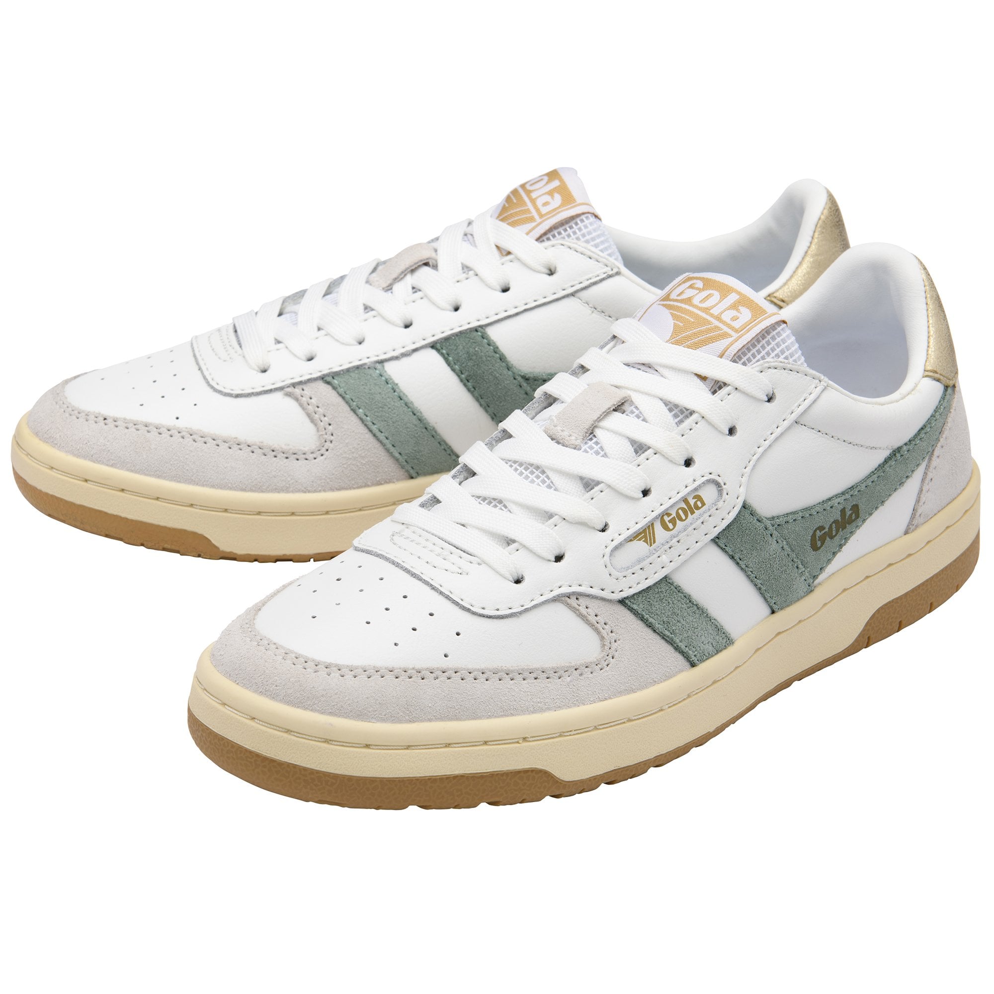 White and green sneakers with gold accents and a gum sole.
