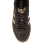 Top-down view of a dark grey Gola sneaker with white stripes and laces.
