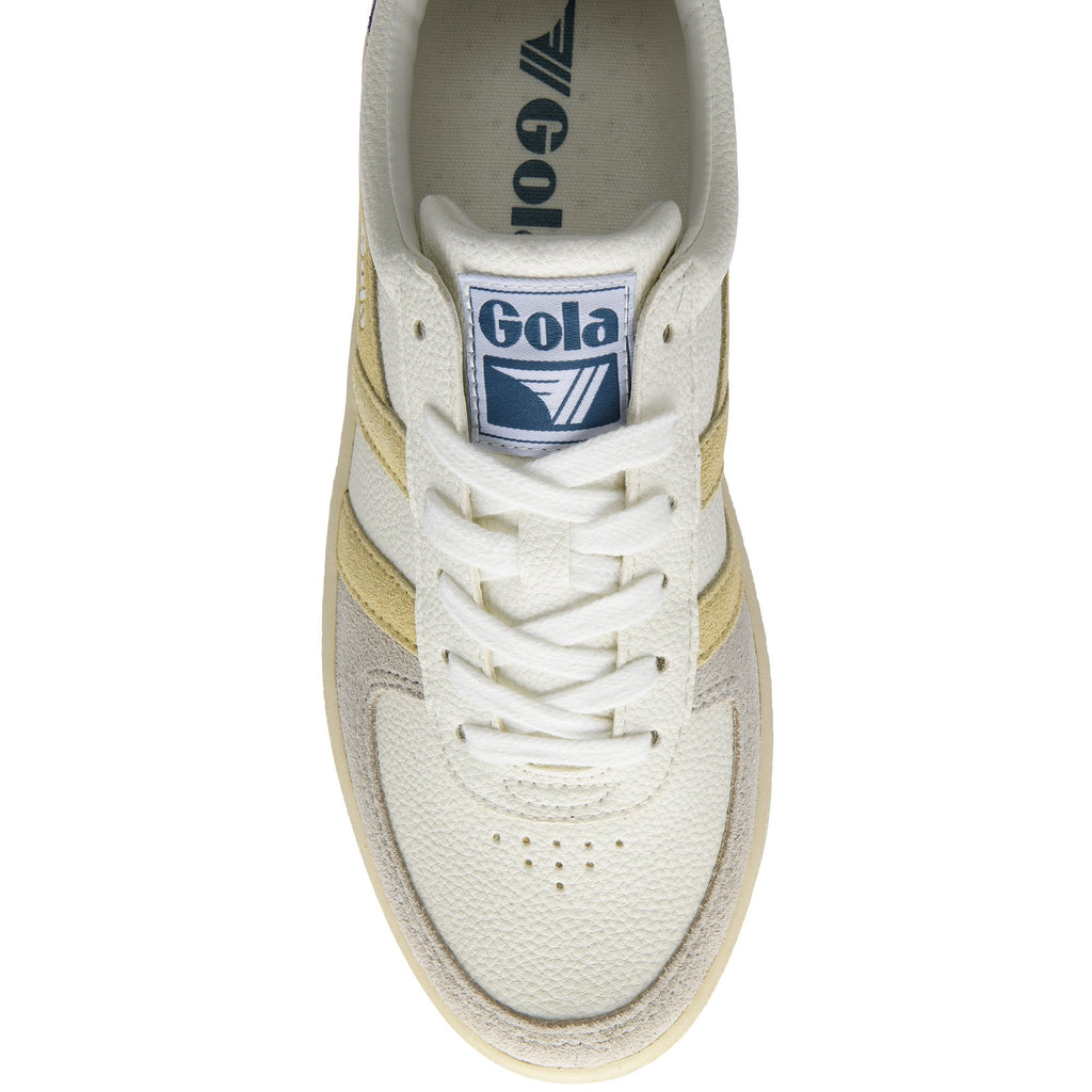 Top-down view of a white Gola sneaker with gold stripes and white laces.