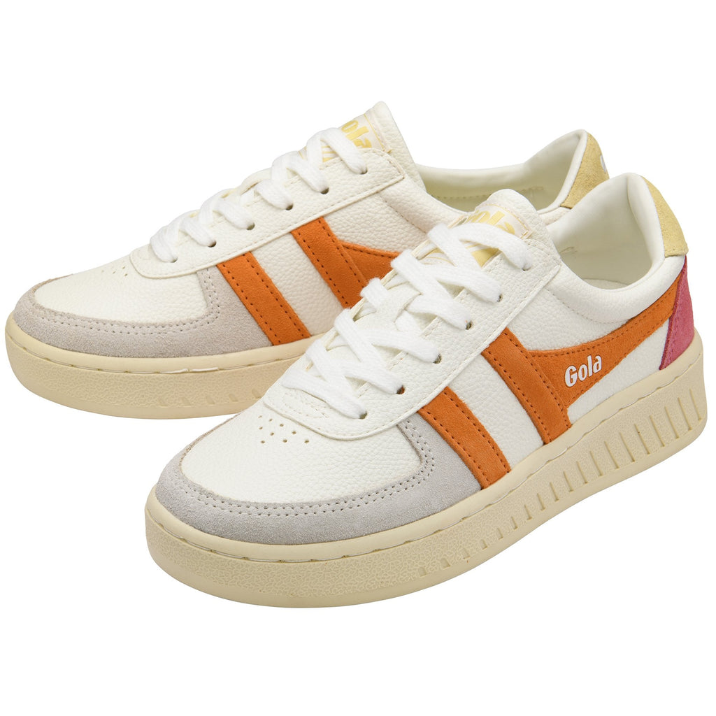 Pair of white Gola sneakers with orange stripes and light grey suede accents.