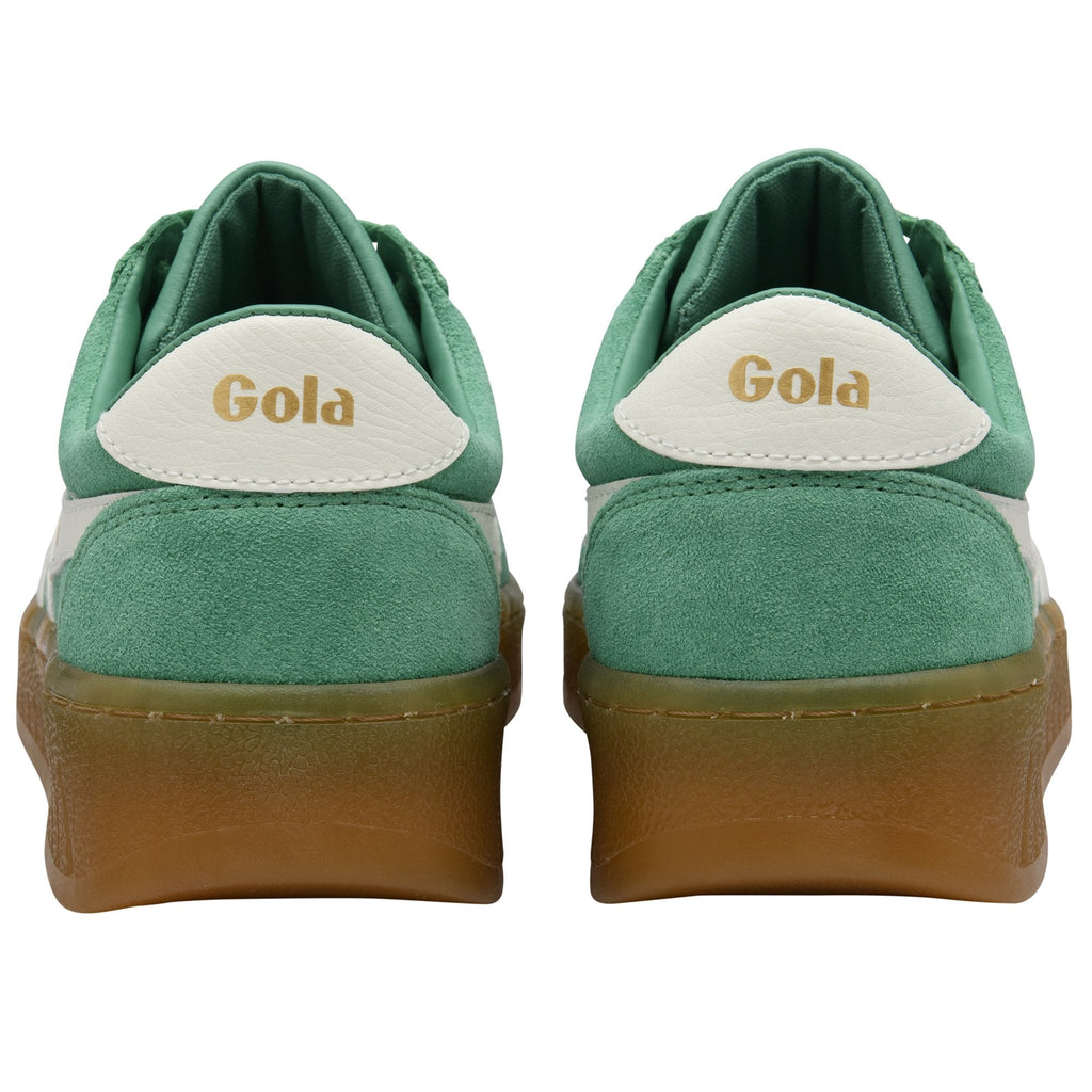 Back view of two green and white Gola sneakers with brown soles.